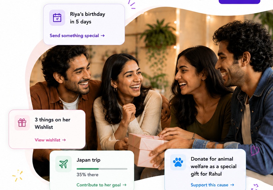 Three friends laughing together as one of them is handed a wrapped gift